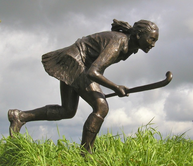 sculpture hockey player bronze